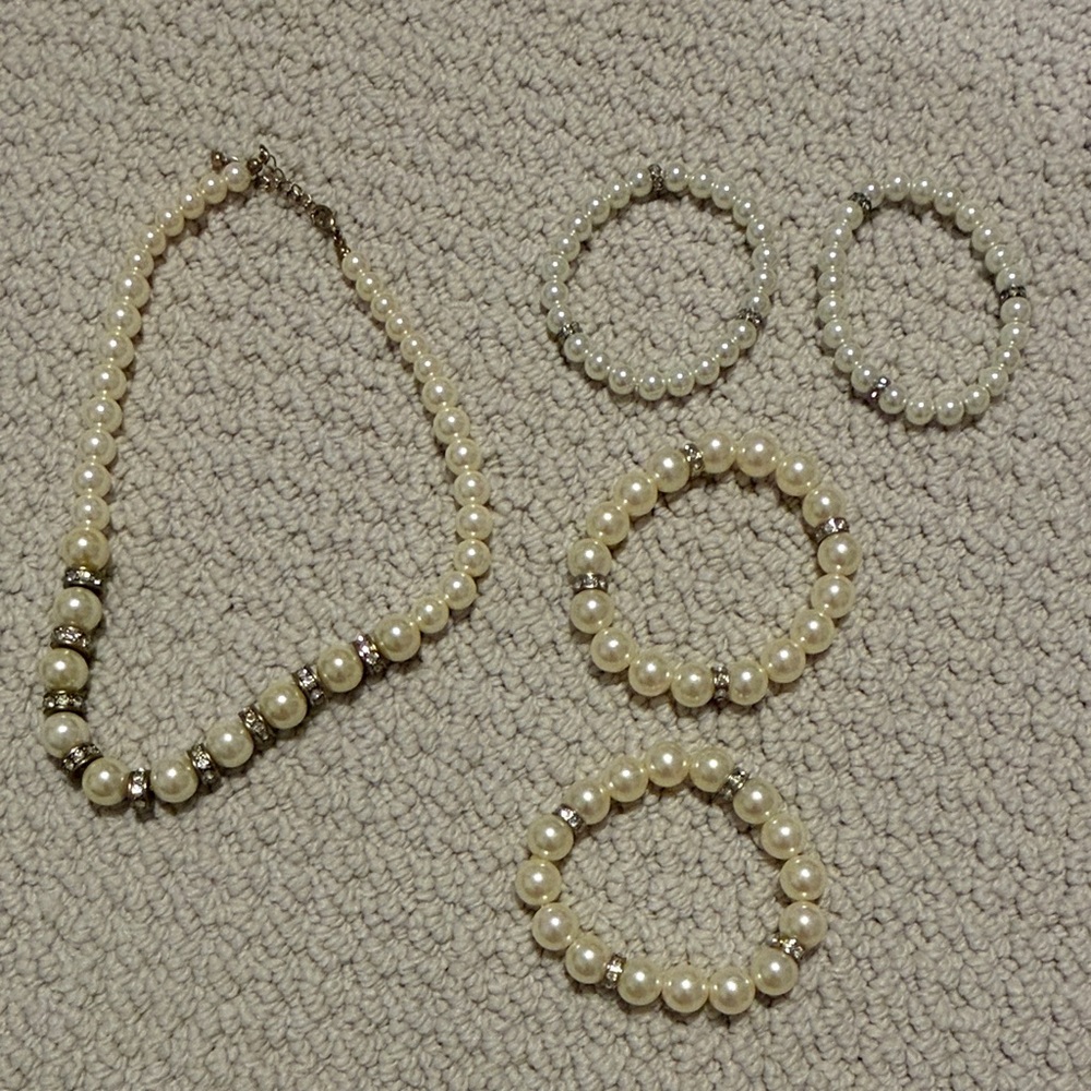 Elegant Pearl and Silver Jewelry Set - one necklace and four bracelets